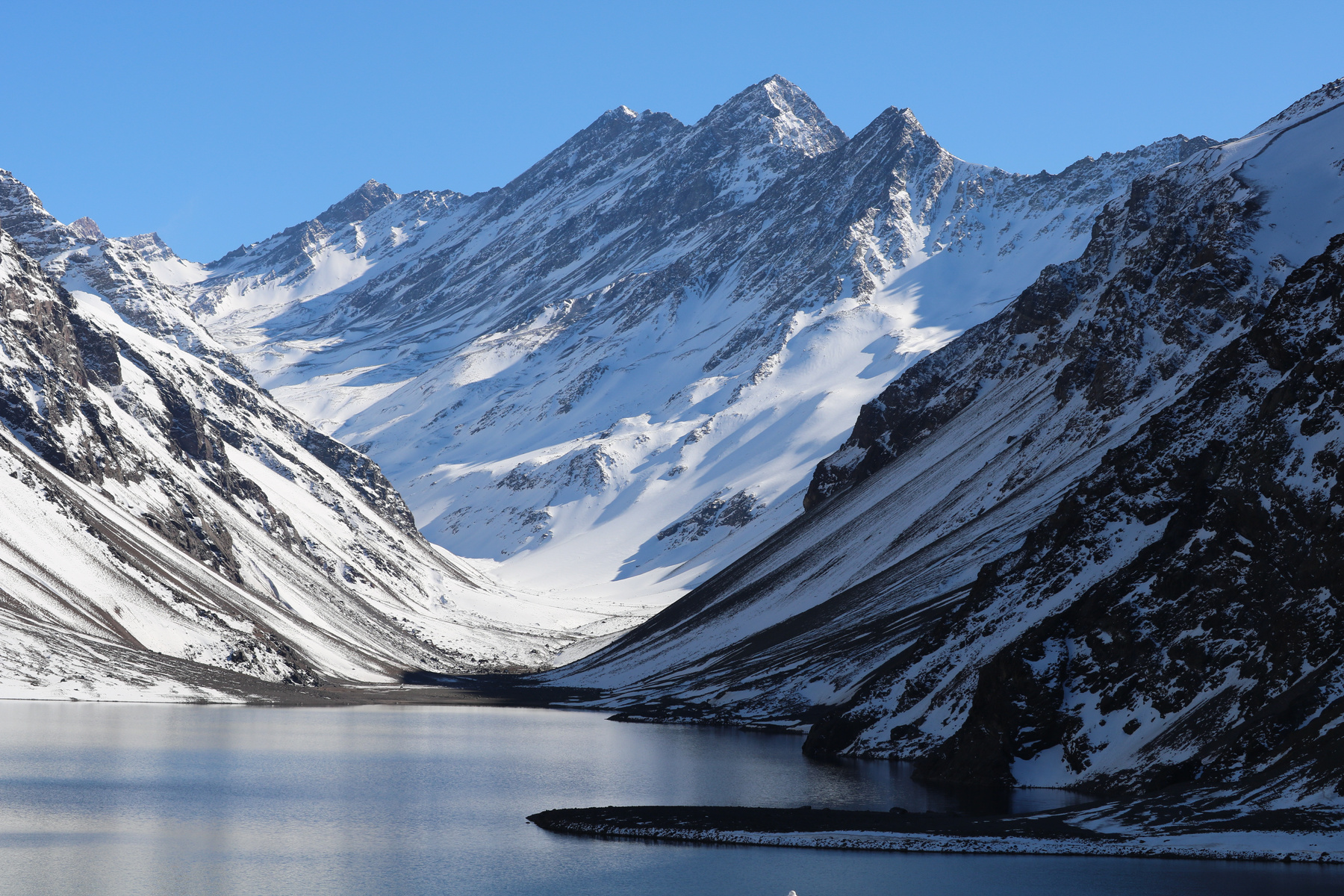 Lake Near Mountains Covered with Snow